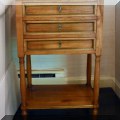 F25. Three drawer side table. 29”h x 18”w x 11.5”d 